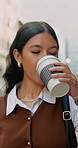 Business, coffee and happy woman with phone in city for travel, work trip or outdoor connection. Female person, traveler or employee with smile, drink or smartphone for network in an urban town