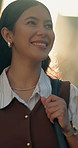 Business, travel and happy woman walking in city for job opportunity, ambition or career journey. Female person, traveler or commute with lens flare for work trip or destination in an urban town