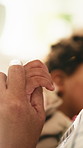 Love, mom and child holding hands in home for safety, parenting and support in living room. Family, mother and kid with bonding together at house for trust, development and guidance or security