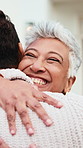 Mother, hug and adult son in front yard with love, family reunion and bonding together for weekend. Happy, mature woman or mom embrace son outdoor by home with care, wellness or visit for connection.