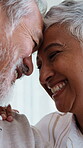 Forehead, touch and old couple with smile in home, retirement or connection with partner on weekend. Senior people, laugh and relax with spouse, flare and happy with relationship commitment in house