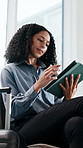 Suitcase, tablet and businesswoman in airport waiting for flight with research for finance report. Digital technology, luggage and financial manager in lobby for work trip, travel or boarding call.