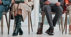 Legs, corporate and people in waiting room for job interview, application and resume for hiring. Feet, candidates and document in workplace with tech, review cv and recruitment process for onboarding