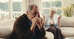 Argument, upset and senior man on sofa in home with fighting, disagreement or divorce on weekend. Stress, couple and elderly person in living room with marriage fail, breakup or conflict in house.
