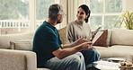 Happy, couple and paperwork in home tablet, review payslip and conversation for household expenses. Married, mature people and talk on sofa with tech, document or financial planning for utility bills