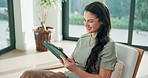 Ebook, happy and woman in lounge with tablet, calm activity and browse on storytelling platform. Digital, chill and person in house with tech, literature site and portable reading in peaceful hobby.