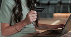 Laptop, credit card and hands in home for online shopping,  typing security code and payment. Debit, computer and woman in living room with discount purchase, digital money and ecommerce transaction