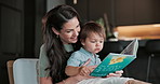 Book, reading and mother with toddler in home for relax, bonding or family connection on weekend. Happy, love and mom with boy baby on sofa for story time together in living room at apartment.