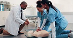 Medical, team or dummy in clinic for cpr training, compression fraction or cardiac arrest technique. People, physician and nurses with mannequin for life saving procedure, practical or certification 