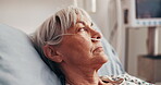 Healthcare, recovery and thinking with patient in hospital bed for monitoring, oxygen or treatment. Breathing tubes, medical and reflection with mature woman in clinic for post surgery contemplation