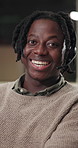 Face, black man and smile with headset in call centre for career pride, about us and night. Portrait, male person and advisor with mic for customer service, technical support and crm representative
