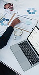 Meeting, above and hands of business people with graph, documents and chart for finance report. Corporate, team and workers with laptop, paperwork and budget planning for investment banking in office