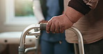 Senior, person and hands with nurse on walker for mobility, walking aid or rehabilitation in clinic. Elderly, caregiver or patient with balance for movement, recovery or physiotherapy in hospital