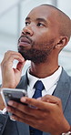 Business, phone and black man thinking in office for solution, idea or problem solving. Thoughtful, businessman and contemplating with smartphone for company research, question or answer in workplace