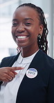 Face, black woman and political badge for vote, election day and event for equality awareness. Portrait, candidate and smile in office for voting rights, social responsibility and democratic campaign