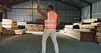 Happy, man or carpenter in warehouse with dance, clipboard or success for timber manufacturing goals. Back, person and groove in woodwork business with checklist, celebration or production milestone.