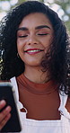 Happy, woman and student in nature with phone, chat and scholarship update for education. Smile, female person or laugh outdoor with mobile app, study schedule and university application for learning