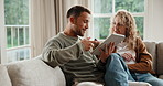 Couple, relax and conversation in apartment with tablet, research and opinion for online shopping. Happy, married people and browsing ecommerce website in home with tech, internet and discussion.