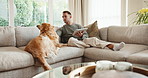 Tablet, relax and man with dog on sofa in home for research on pet adoption, foster care or wellness. Happy, digital technology and person reading blog on app for animal health in house with puppy.