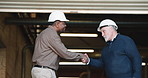 Men, architect or meeting with handshake in warehouse for building agreement or construction deal. Male people, contractor or civil engineer shaking hands with introduction for b2b or partnership