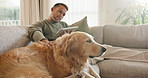 Tablet, love and man with dog on sofa in home for research on pet adoption, foster care or wellness. Relax, digital technology and person reading blog on app for animal health in house with puppy.