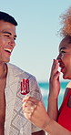 Beach, group and friends with ice cream for smile, laugh and bonding together on vacation. Seaside, people and relax on summer holiday with snack, treat or travel with cheers for reunion trip
