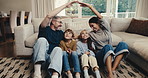 Safety, family and roof gesture for bonding together, kids and parents on break with connection in house. Smile, children and people on floor in living room for relax, love and support in home lounge