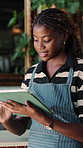 Happy, black woman and waitress with tablet in cafe with research, inventory or online menu update. Smile, digital technology and barista in coffee shop for order on app, website or customer service.