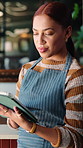 Smile, woman and waitress with tablet in cafe with research, inventory or online menu update. Happy, digital technology and barista in coffee shop for order on app, website or customer service.