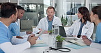 Medical, team or talk in clinic meeting for patient case review, treatment options or discharge plan. People, doctors and nurses with tech for diagnosis report, care coordination and clinical opinion