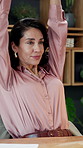 Complete, finance and stretching with business woman at desk in office to finish budget report. Done, hands behind head and risk management with mature employee in workplace for online investment