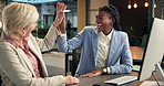 Happy, women and computer with high five for business success, winning or achievement in office. Female people, employees or team with technology for good news, project or celebration in workplace