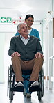 Walking, nurse and senior man in wheelchair in hospital for support, checkup or medical assistance. Happy, caregiver and elderly person with disability in clinic for consultation, help or discharge.