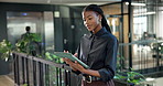 Sustainable, reading or black woman in agency with tablet, impact research or review of esg report. Digital, scroll or csr consultant with tech, green strategy framework or feedback on eco compliance