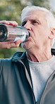Fitness, drink and old man in city for rest, workout recovery and hydration with bottle. Exercise break, active retirement and senior person with water for health, beverage and thirsty with runner