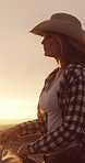 Woman, horse and cowboy hat at sunset with riding, calm and countryside view for equine hobby. Person, equestrian practice or rider at dusk on horseback, scenic or peaceful with animal on Utah ranch