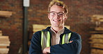 Face, man and happy with arms crossed in carpentry for joinery expertise, skilled trade and pride. Glasses, carpenter and smile in warehouse for woodworking confidence, craftsmanship or manufacturing