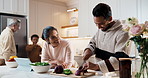 Family, cooking and cutting with vegetables in kitchen for meal prep, recipe or food together. Parents, grandparents or child with board or ingredients for organic cuisine or healthy salad in home