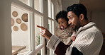 Father, window and view with baby girl in living room with smile, bonding and connection with love. People, dad and child for chat, relax or fun with toddler for security or support in family home