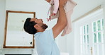 Father, throw and play with baby girl in living room with smile, bonding and connection with love. People, dad and child for kiss, laugh or fun with toddler for security or support in family home