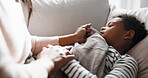Sick, mom and kid in home with thermometer, childcare and health monitor with flu symptoms. Comfort, mother and child on couch with tech, parenthood and temperature check in illness assessment.
