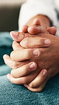 Home, holding hands and couple on couch with love, comfort and care for bonding and marriage. People, man and woman together with relationship, relax or trust with romance and support in living room