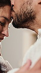 Love, smile and couple kiss in home, laughing and partner loyalty with relationship wellness. Forehead touch, man and woman with romantic commitment, flare and deep connection with funny soulmate