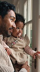 Baby, father and child by window with care, development support and bonding together with view. Love, parent and carry infant kid by door for observation, growth and happy with safety in family home