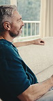 Happy, thinking and man with drink on sofa for reflection, calm and peaceful weekend in home. Relax, morning and mature person with coffee for nostalgia, wellness and thoughtful in living room