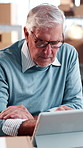 Logistics, research and man with tablet in warehouse, inventory management or plan for distribution. Shipping, entrepreneur and mature person with tech, online and checking ecommerce order on website