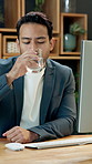 Businessman, computer and drinking water in office with glass, hydration and typing report for work. Happy, person and healthy nutrition in workplace with H2O, refreshing liquid and desktop for job.