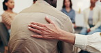 Therapist, patient and hand in support group with comfort, psychology advice and rehabilitation help. Counselor, people and console man in therapy meeting with empathy, compassion and understanding.