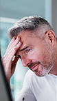Businessman, headache and glasses in office with computer, paralegal mistake and lawsuit pressure. Lawyer, mature person and migraine in firm with desktop, legal error and tired of court case stress.