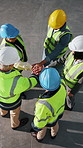 Above, meeting and engineer with hands together in warehouse for construction, motivation or success. People, team and contractors piling with applause for winning, celebration or unity in depot